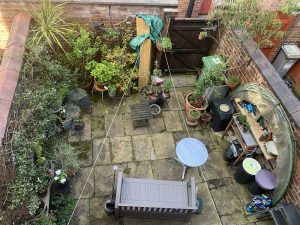 HortiHood 90 Folding Wall-Mounted Greenhouse after many years use in back yard of Kate in Manchester - thanks for the image Kate!